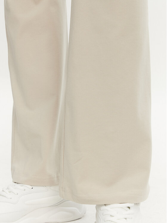 adidas adidas Legginsy Essentials Small Logo JD3072 Beżowy Flare Fit