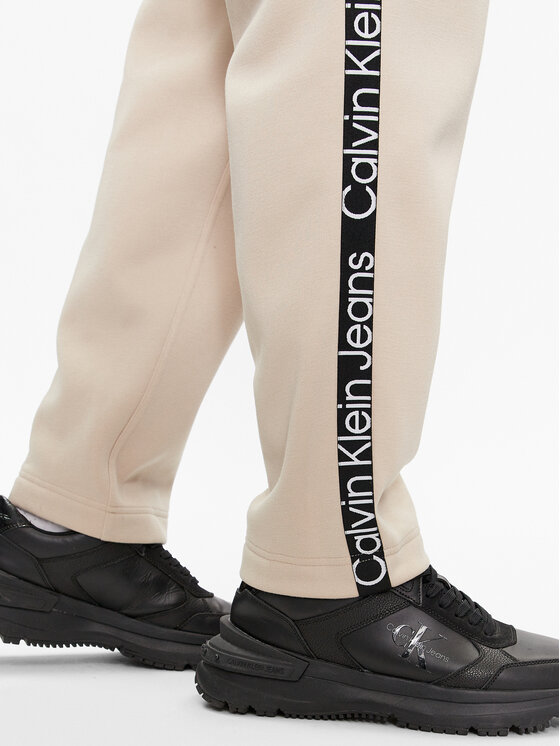 Calvin Klein Jeans Calvin Klein Jeans Spodnie dresowe Logo Tape J30J324376 Beżowy Relaxed Fit