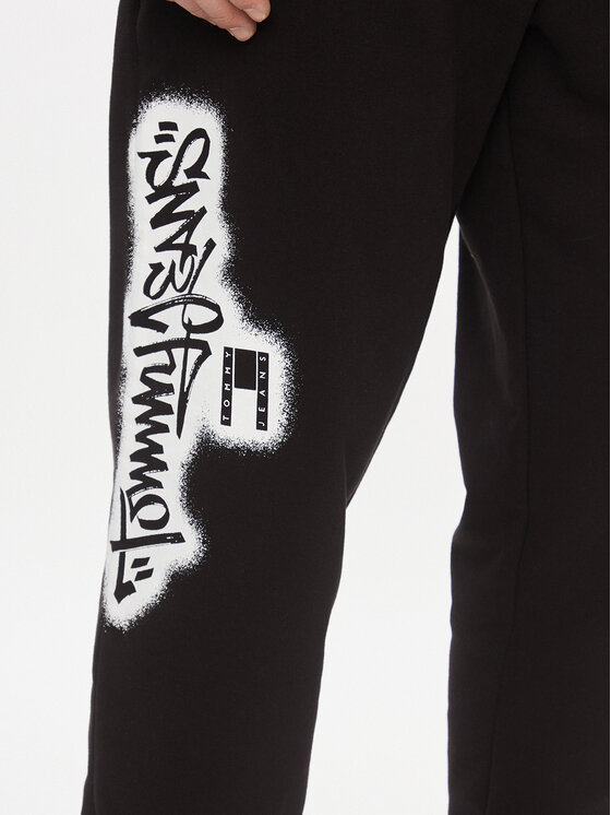 Tommy Jeans Tommy Jeans Donji dio trenerke Tjm Reg Tommy Spray Sweatpant DM0DM18376 Crna Regular Fit