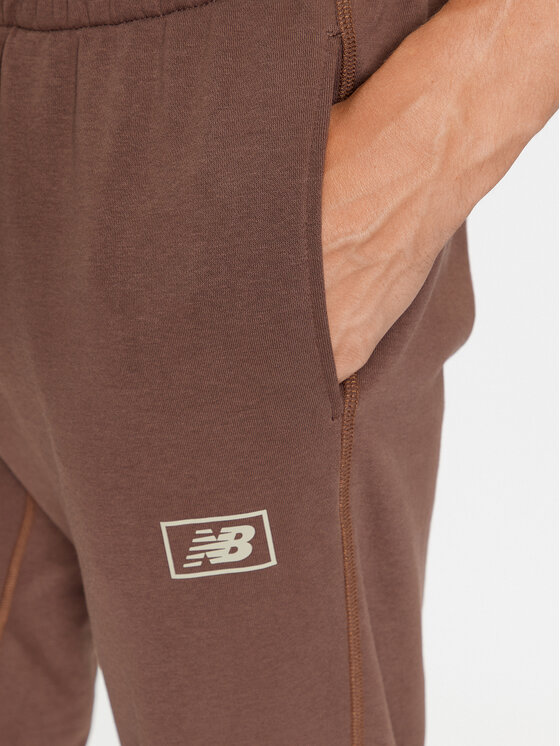New Balance New Balance Долнище анцуг NB Essentials Sweatpant MP33509 Кафяв Regular Fit