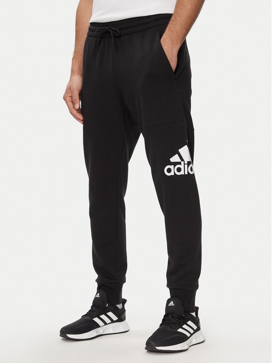 adidas Sporta bikses Essentials French Terry Tapered Cuff Logo Joggers HA4342 Melns Regular Fit