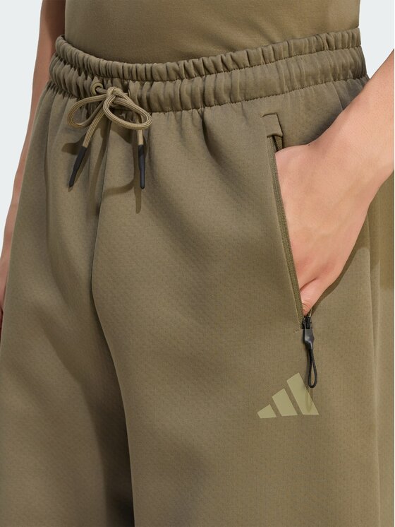adidas adidas Spodnie materiałowe Z.N.E. OPEN HEMZ.N.E. OPEN HEM Zielony Loose Fit