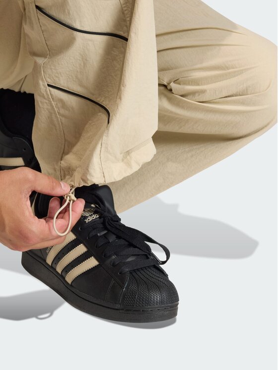 adidas adidas Spodnie dresowe Cutline Beżowy Loose Fit