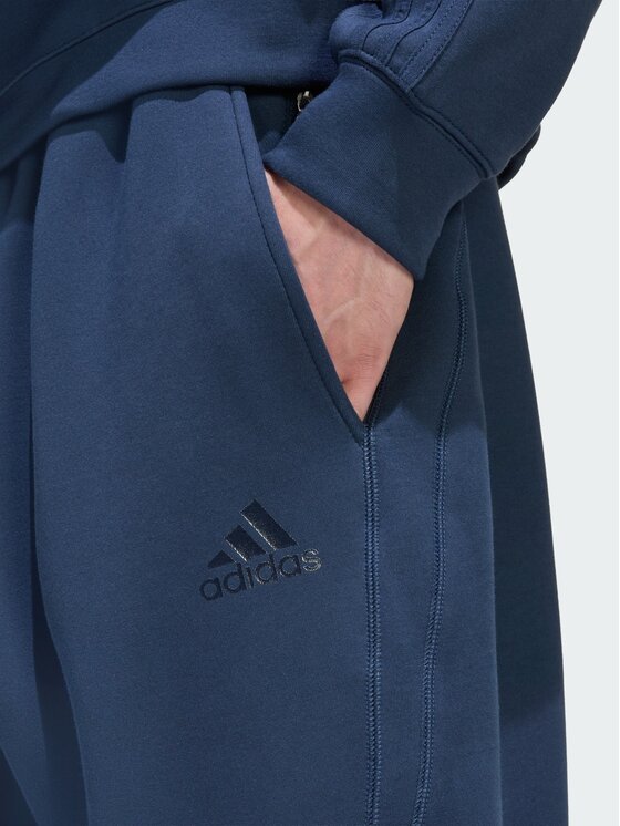 adidas adidas Spodnie materiałowe 159229 Niebieski jasny Loose Fit