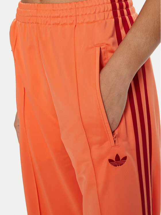 adidas adidas Долнище анцуг adicolor Classic Firebird JP2309 Оранжев Loose Fit