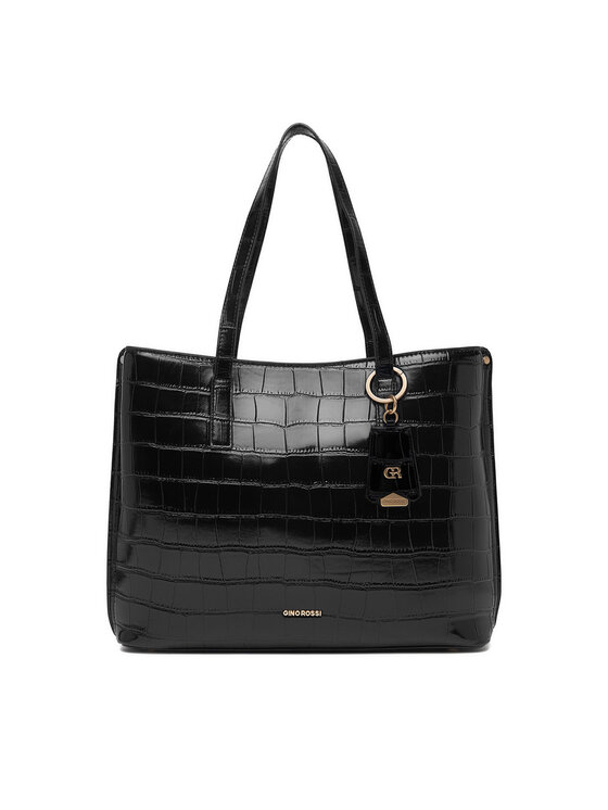 Torebka shopper ustawiona przodem, widoczne uchwyty i ozdobny brelok.