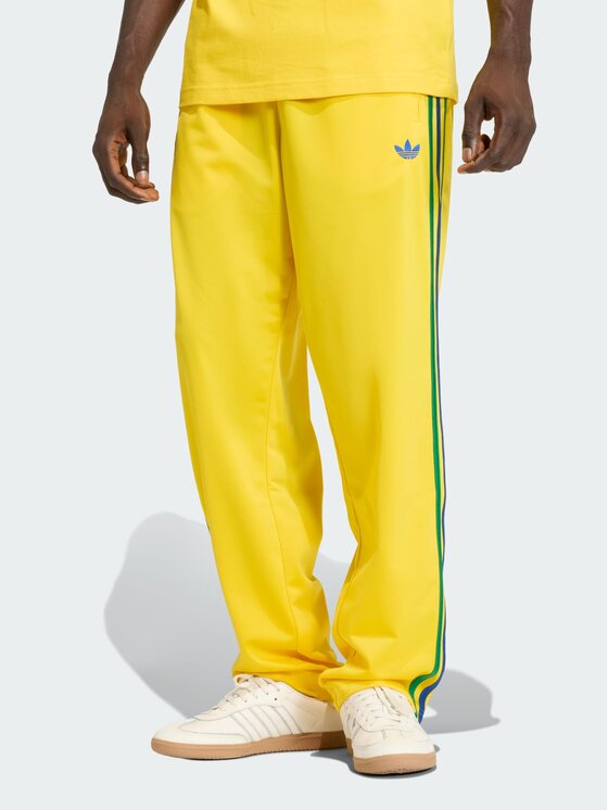 adidas adidas Spodnie dresowe FIREBIRD Żółty Regular Fit