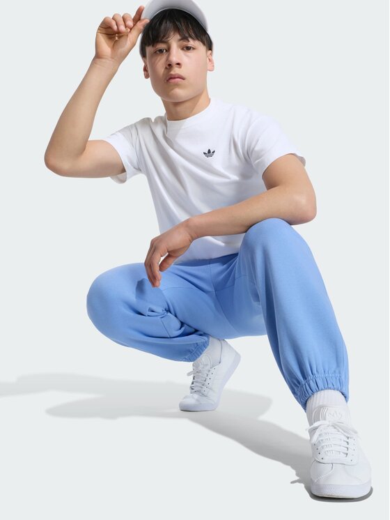 adidas adidas Spodnie materiałowe 168911 Niebieski jasny Oversize