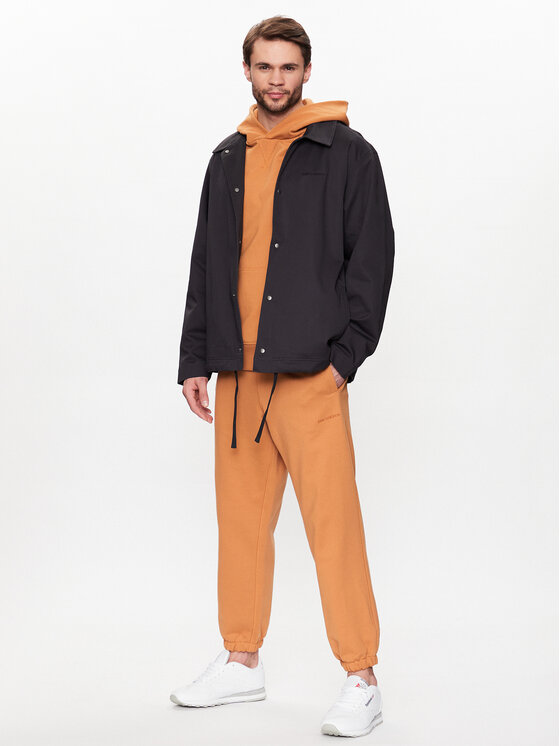 New Balance New Balance Pantaloni trening MP23551 Portocaliu Relaxed Fit