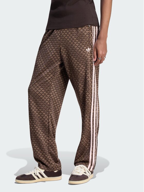 adidas adidas Spodnie dresowe Firebird loose monogram Brązowy ciemny Regular Fit