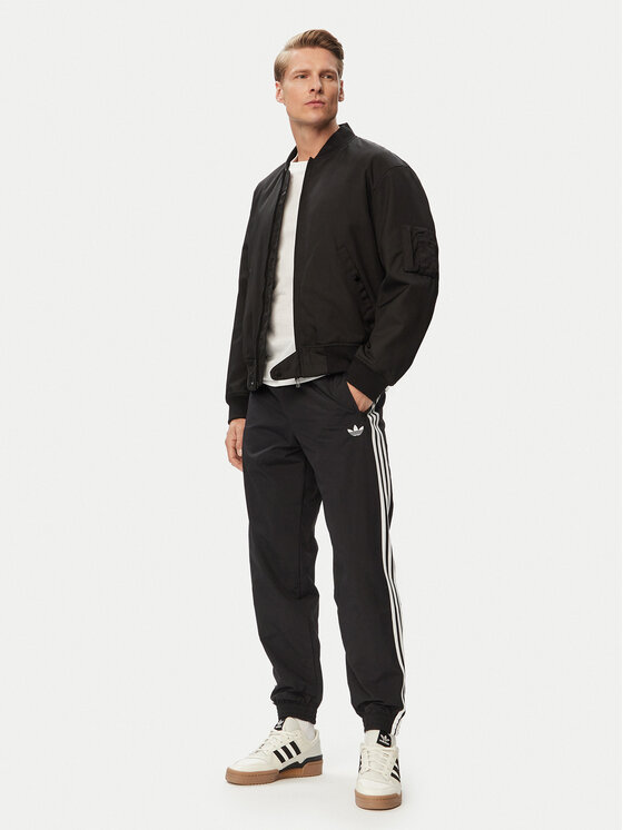 adidas adidas Donji dio trenerke Firebird Woven KE1371 Crna Regular Fit