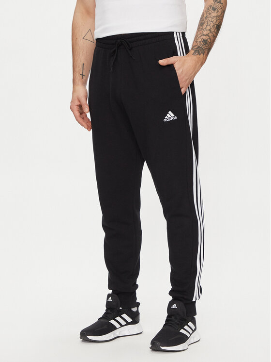 Adidas Spodnji Del Trenirke Essentials French Terry Tapered Cuff 3-Stripes Joggers HA4337 Črna Regular Fit