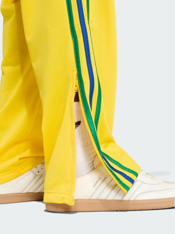 adidas adidas Spodnie dresowe FIREBIRD Żółty Regular Fit