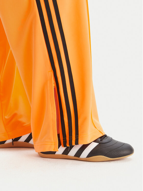 adidas adidas Spodnie dresowe adicolor Classic Firebird JY2694 Żółty Loose Fit