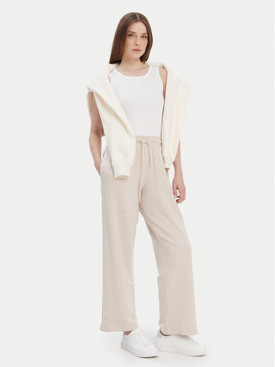 Tommy Hilfiger Tommy Hilfiger Pantaloni trening UW0UW04771 Bej Relaxed Fit