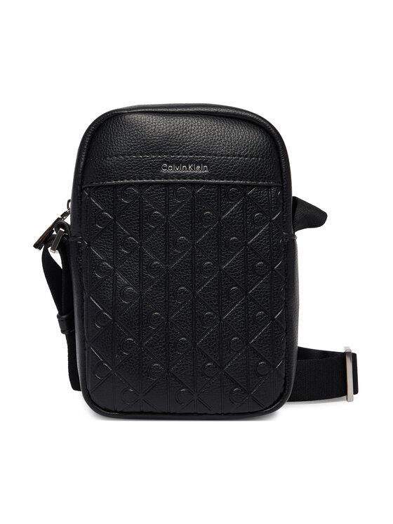 Calvin Klein Geantă crossover Emblem Aop Emboss Slim Reporter LV04D3228G Negru