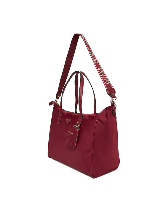 Torebka shopper pokazana pod kątem z widocznym paskiem na ramię u góry.