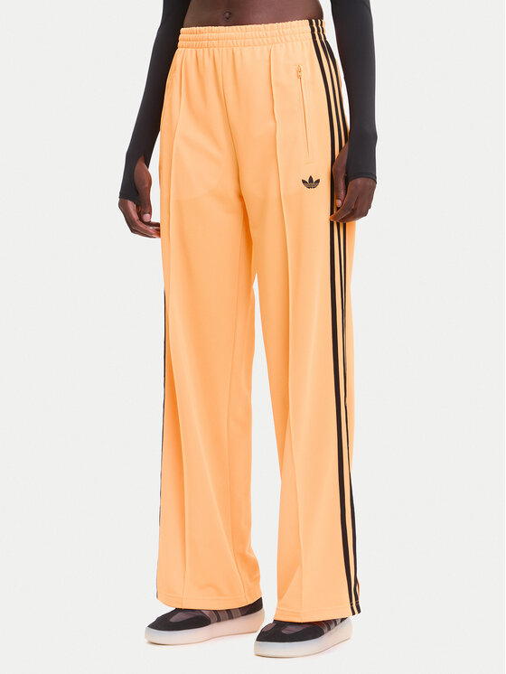 adidas Spodnie dresowe adicolor Classic Firebird JY2694 Żółty Loose Fit