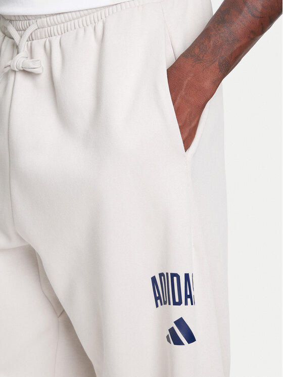 adidas adidas Spodnie dresowe Collegiate JM9177 Beżowy Regular Fit