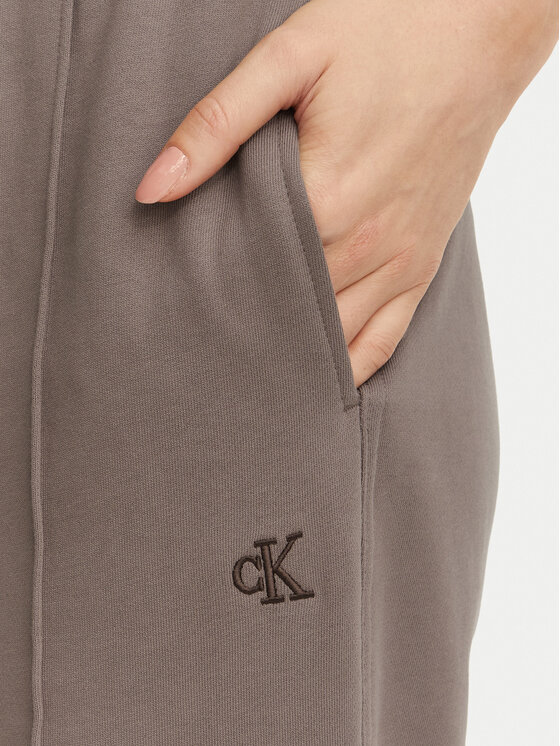 Calvin Klein Jeans Calvin Klein Jeans Spodnie dresowe Monogram LV047H220G Beżowy ciemny Regular Fit