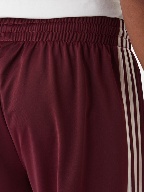 adidas adidas Spodnji del trenirke KE1651 Bordo rdeča Regular Fit