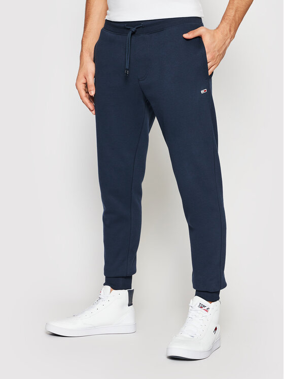 Tommy Jeans Spodnie dresowe DM0DM11163 Granatowy Slim Fit • Modivo.pl