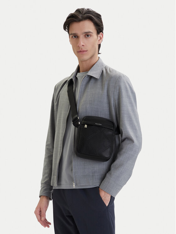 Calvin Klein Geantă crossover Emblem Aop Emboss Reporter LV04D3331G Negru