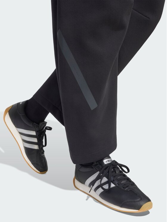 adidas adidas Riidest püksid Z.N.E. OPEN HEMZ.N.E. OPEN HEM Must Loose Fit
