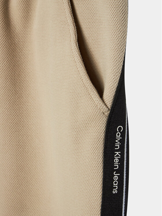 Calvin Klein Jeans Calvin Klein Jeans Donji dio trenerke Interlock IB0IB01931 Bež Relaxed Fit