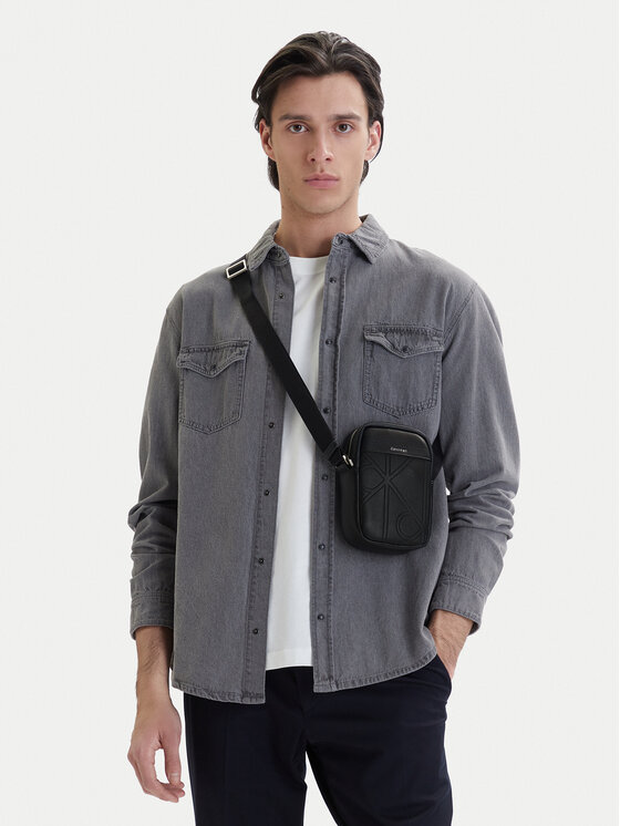 Calvin Klein Geantă crossover Emblem Aop Emboss Slim Reporter LV04D3371G Negru