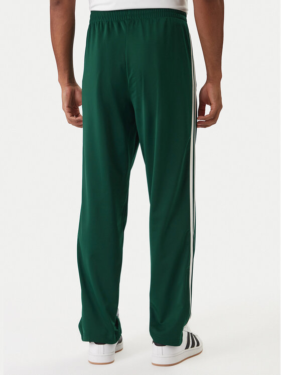 adidas adidas Spodnji del trenirke Firebird KD8317 Zelena Loose Fit