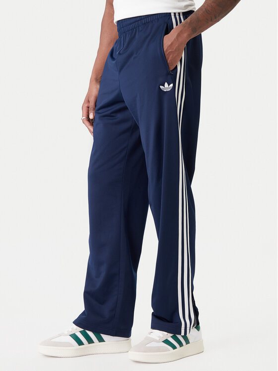 adidas adidas Pantaloni da tuta Firebird KD8316 Blu scuro Loose Fit