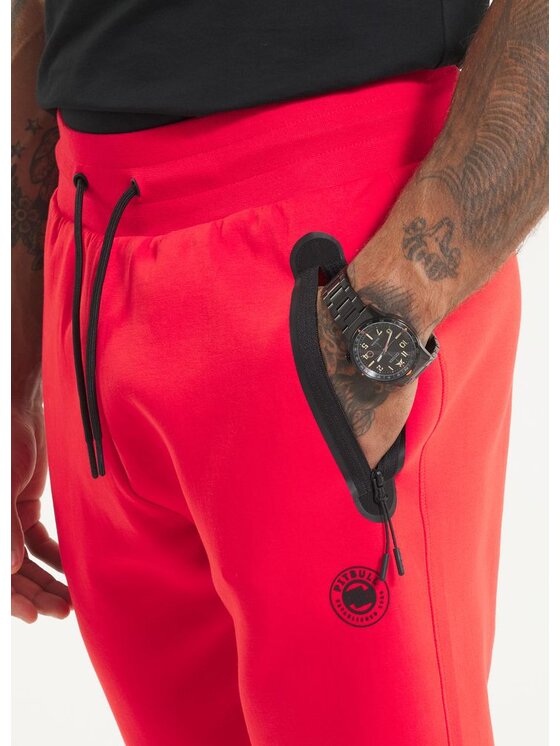 PITBULL PITBULL Spodnie dresowe Spodnie dresowe męskie DOGWOOD POCKET XL Pomarańczowy Regular Fit