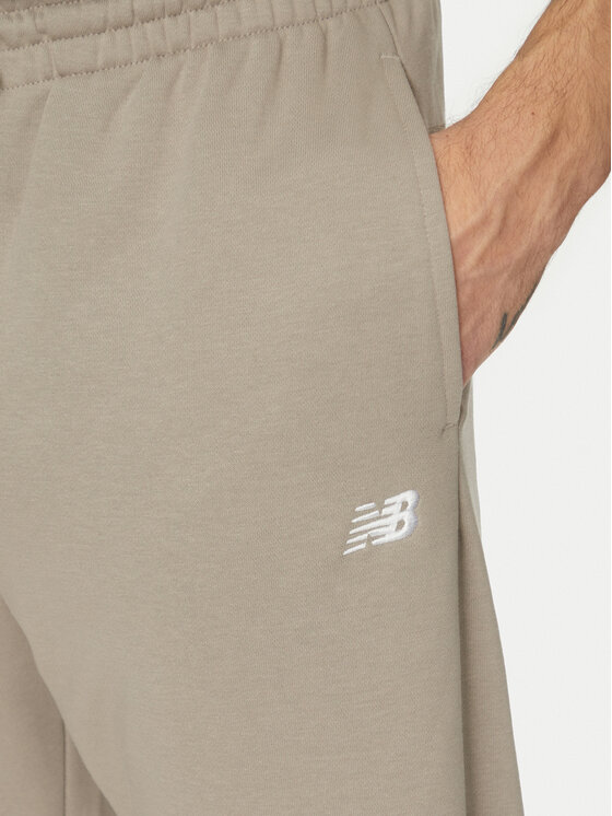 New Balance New Balance Spodnie dresowe Essentials MP41519 Beżowy Relaxed Fit