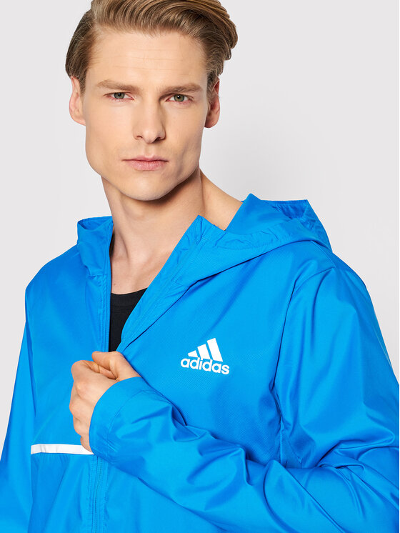 adidas adidas Geacă pentru alergare Own the Run HB7426 Albastru Regular Fit