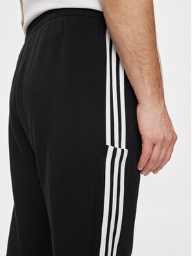 Adidas Spodnji Del Trenirke Essentials French Terry Tapered Cuff 3-Stripes Joggers HA4337 Črna Regular Fit