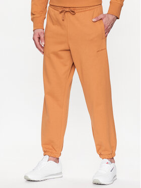 New Balance New Balance Sportinės kelnės MP23551 Oranžinė Relaxed Fit