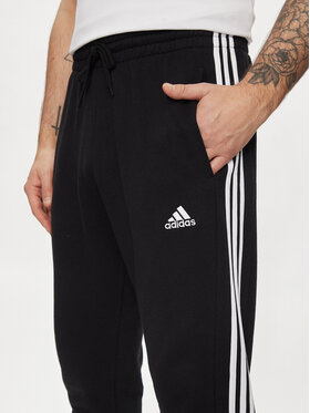 Adidas Spodnji Del Trenirke Essentials French Terry Tapered Cuff 3-Stripes Joggers HA4337 Črna Regular Fit