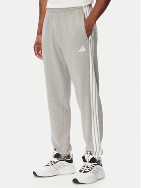 adidas adidas Dressipüksid Essentials 3-Stripes KY4195 Helehall Regular Fit