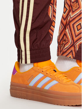 Adidas Spodnji Del Trenirke FARM Rio Premium IV9761 Oranžna Loose Fit