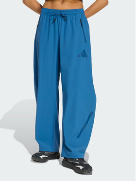adidas adidas Spodnie materiałowe 159193 Niebieski jasny Loose Fit