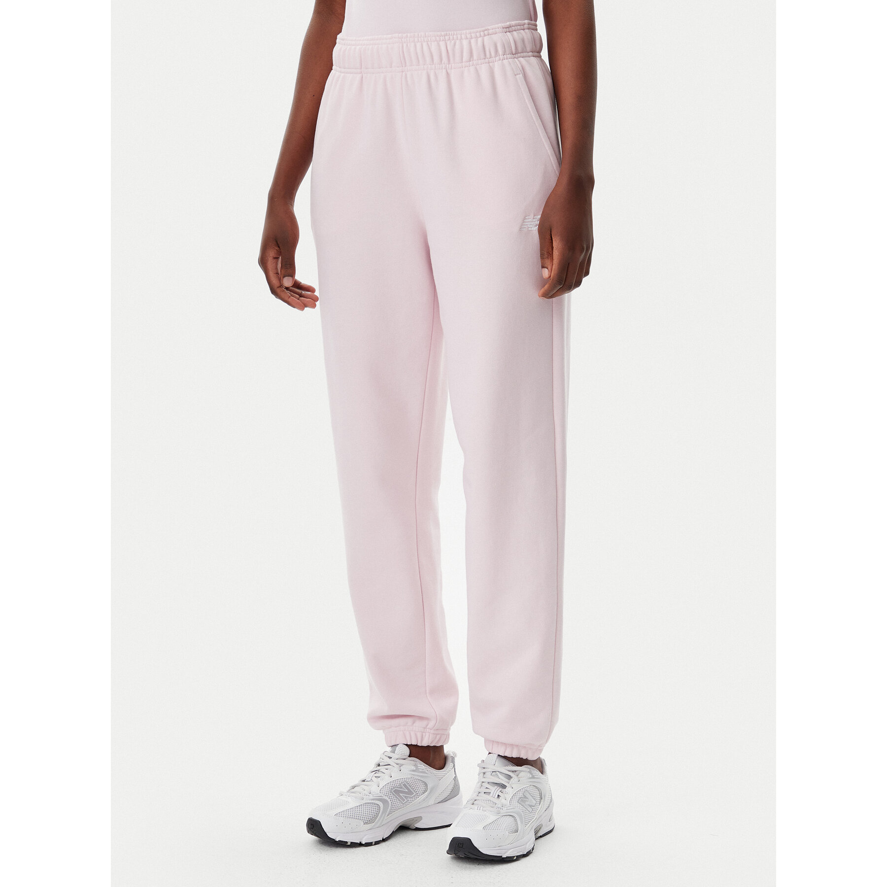 New Balance Spodnie dresowe Essentials WP41500 Różowy Relaxed Fit
