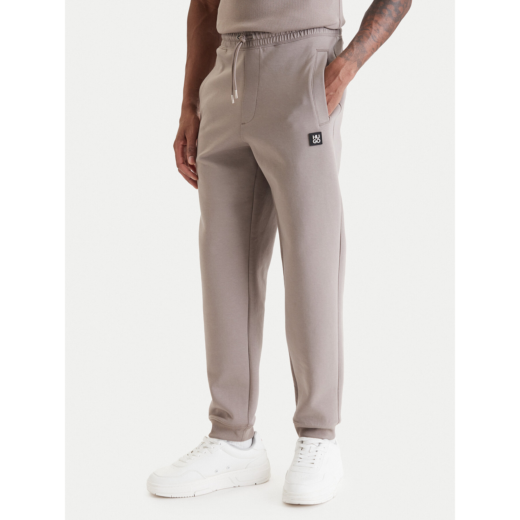 HUGO Spodnie dresowe Dimacs 50533695 Beżowy Relaxed Fit